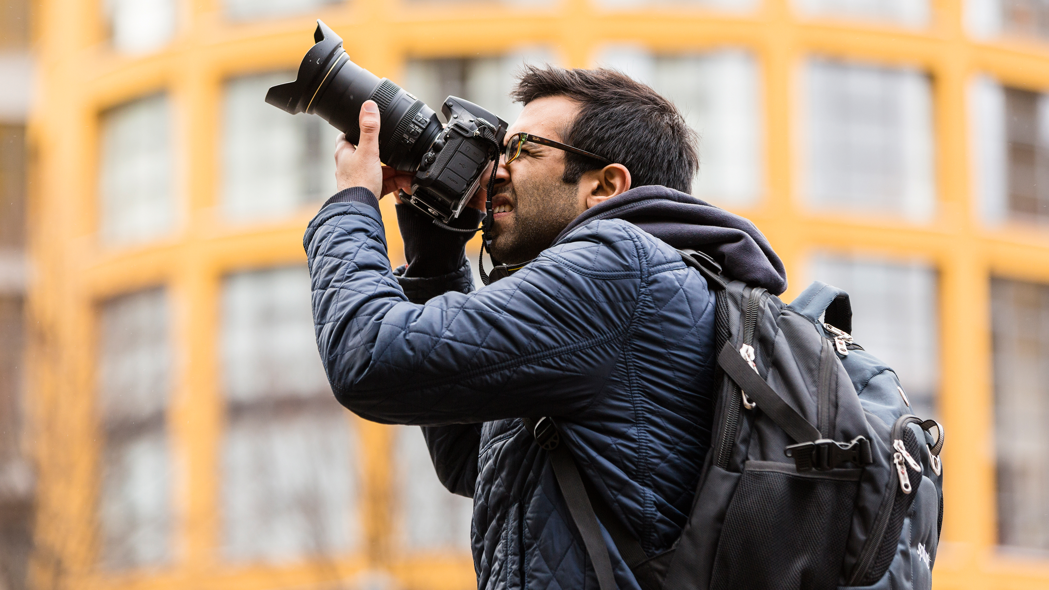 Stock photographer using a professional camera